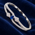 ANNIAURA silver-tone AD statement kada bracelet in blue